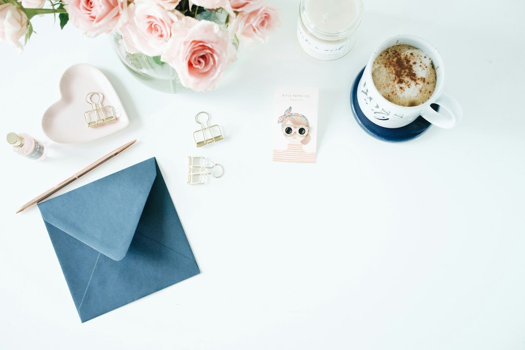 Blue envelope beside a white mug, illustrating a free postal sweepstakes entry.